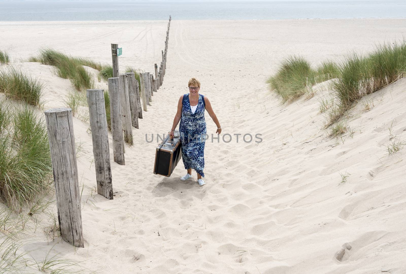 woman with suitcase   by compuinfoto