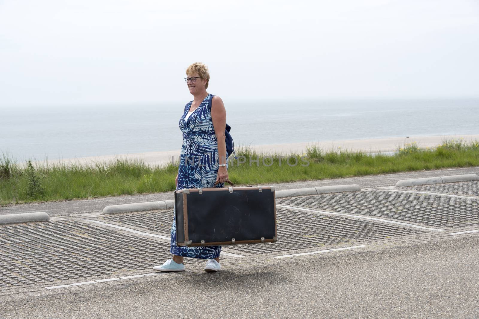 woman with suitcase   by compuinfoto