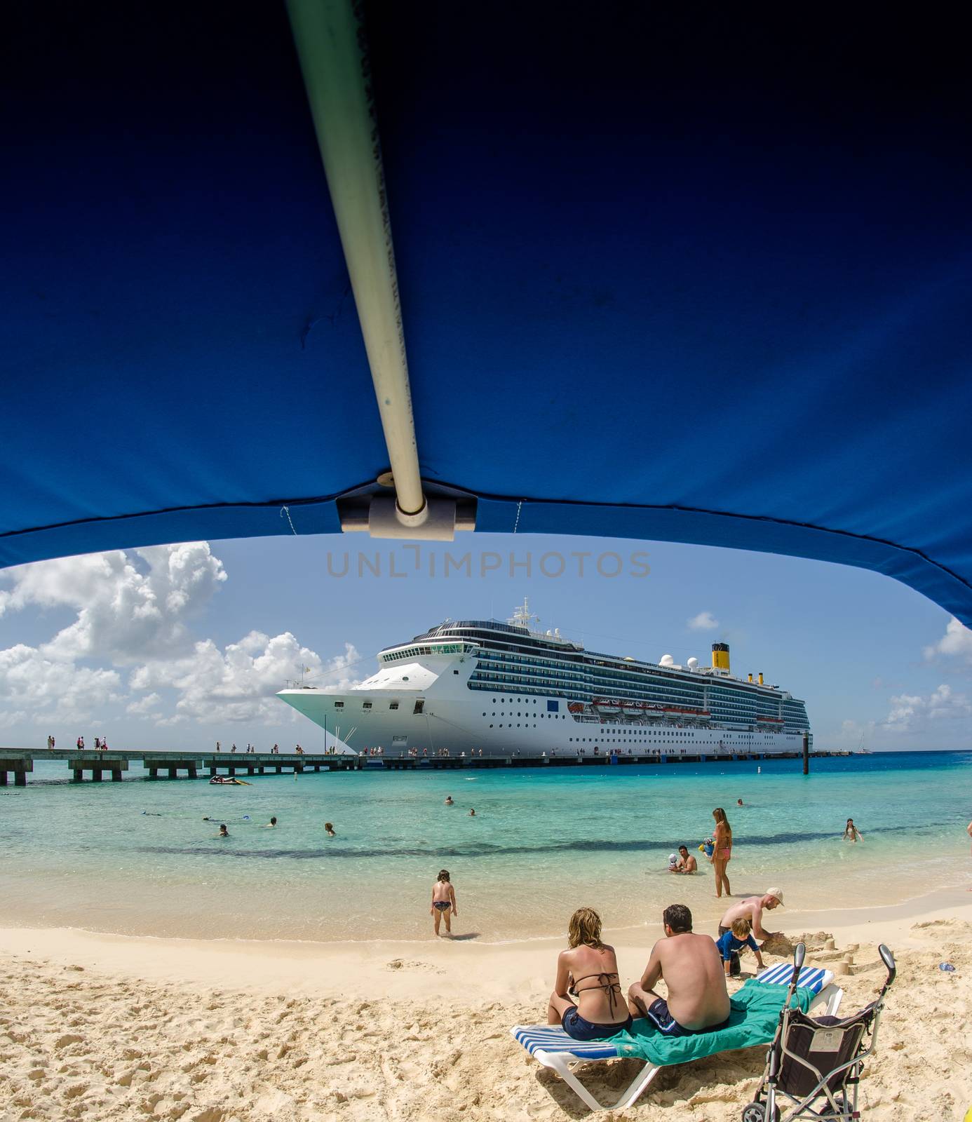 Beautiful beach with crystal clear blue waters against blue sky