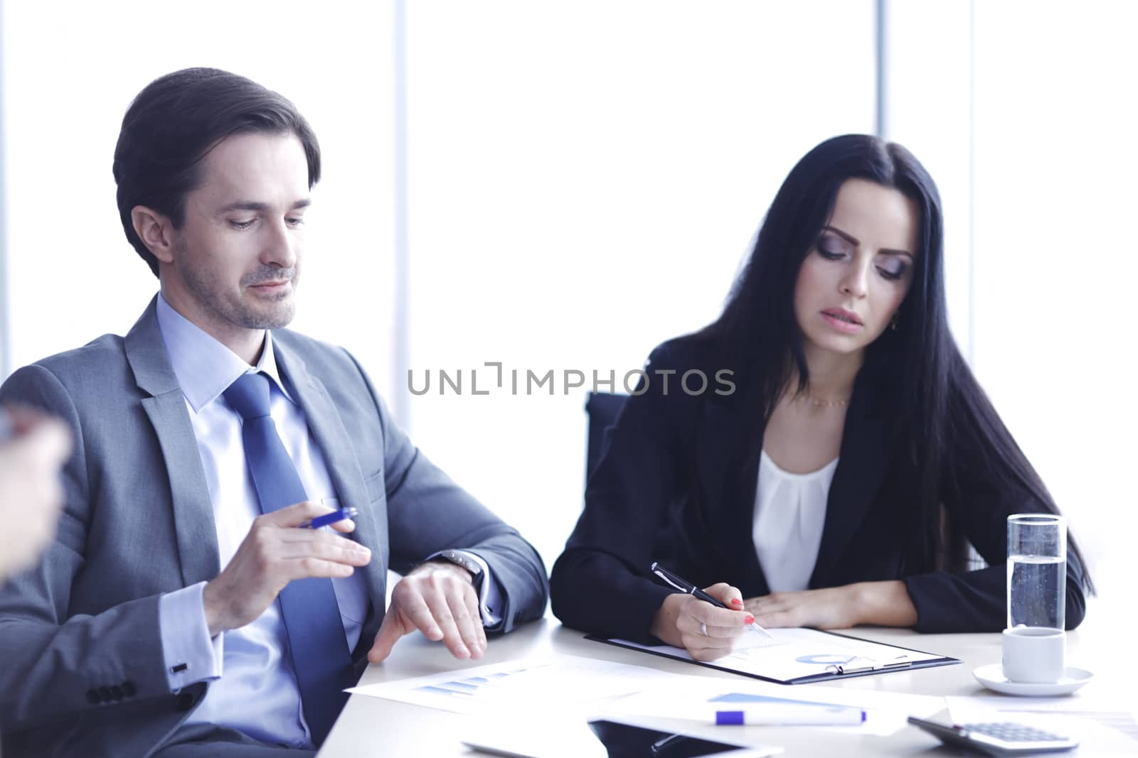 Business people discussing financial reports during a meeting