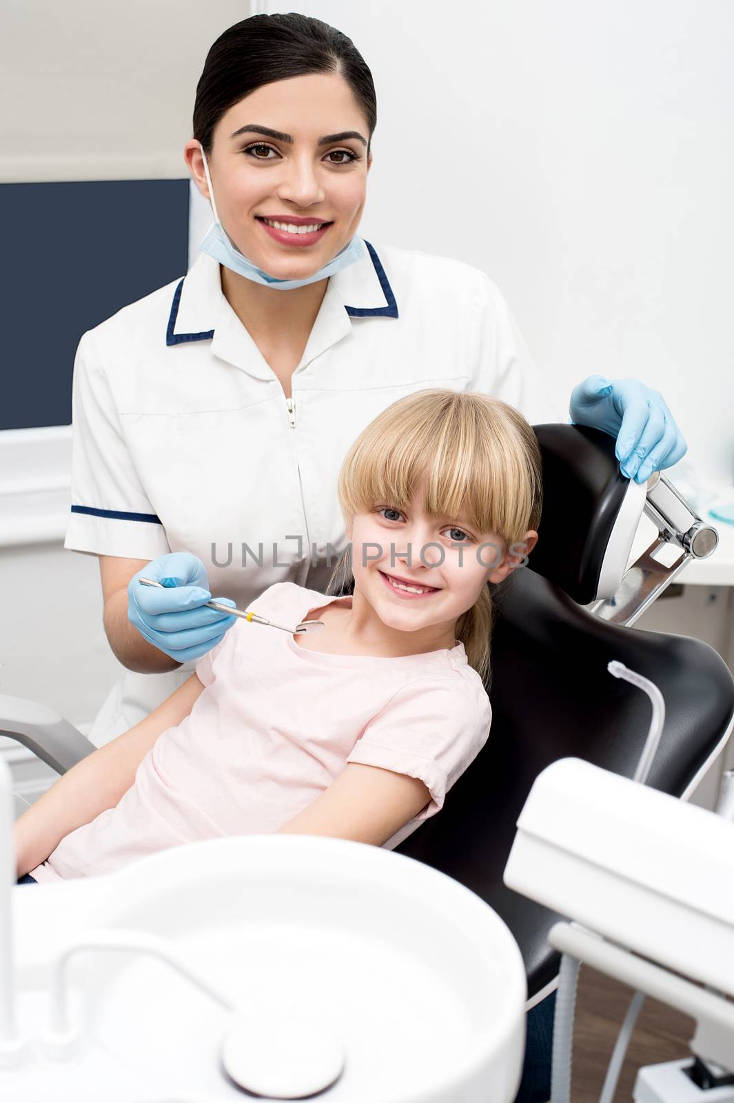 Little girl at annual dental checkup by stockyimages