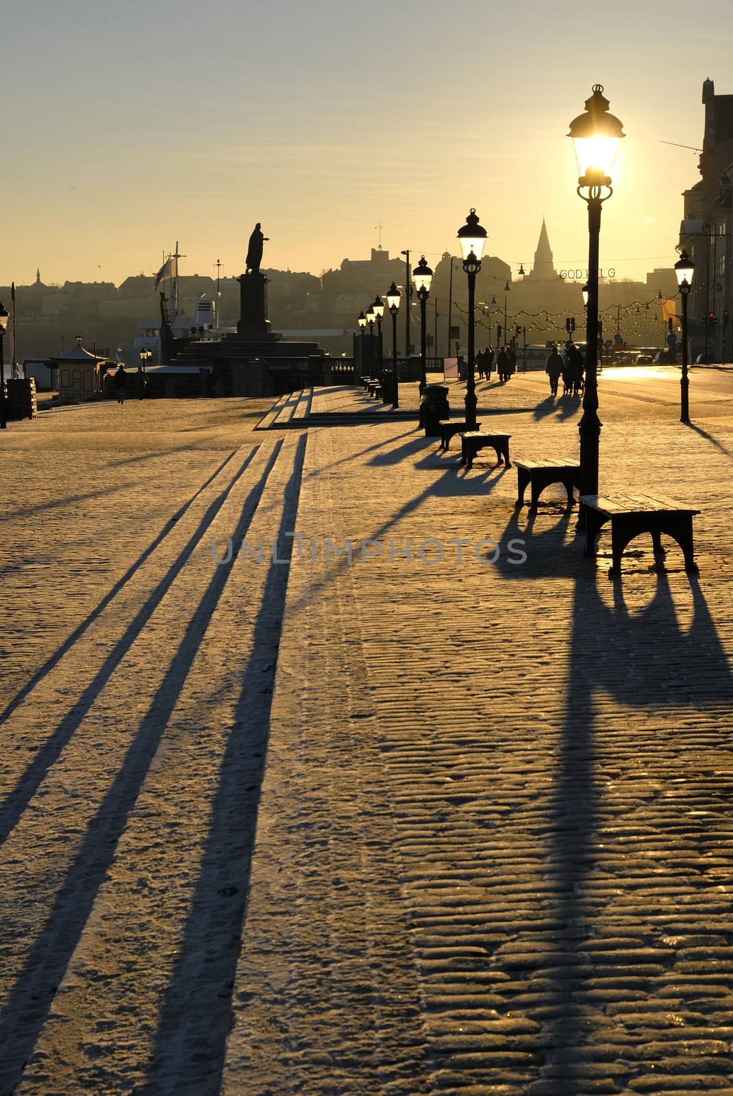 Cobblestone street below the Stockholm Palace in backlight.