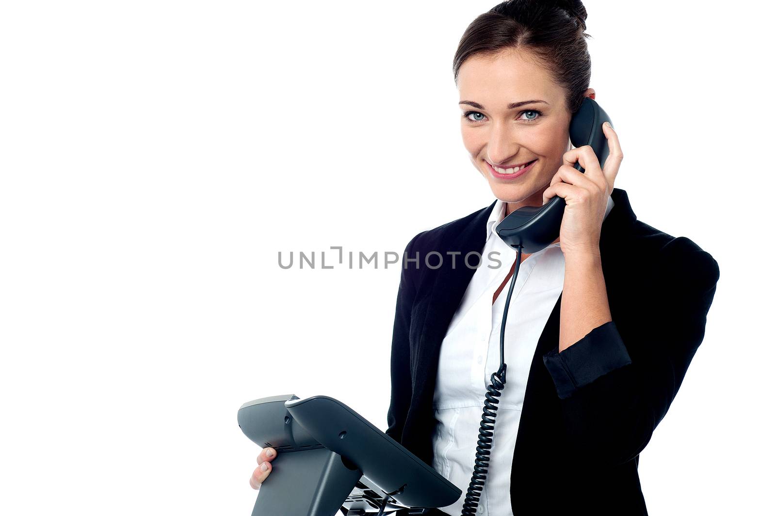 Smiling secretary attending business call