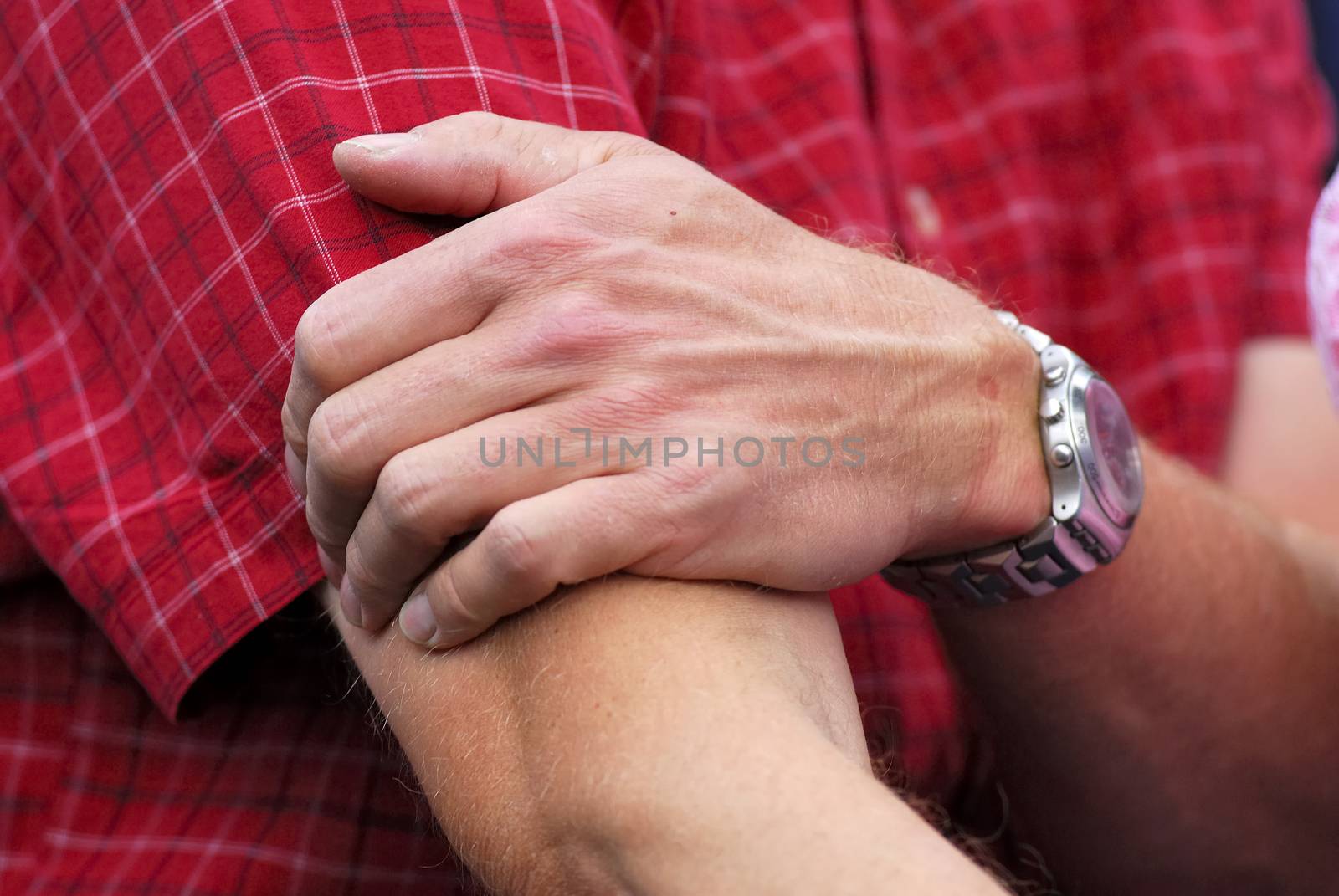 Closeup of man massaging elbow .