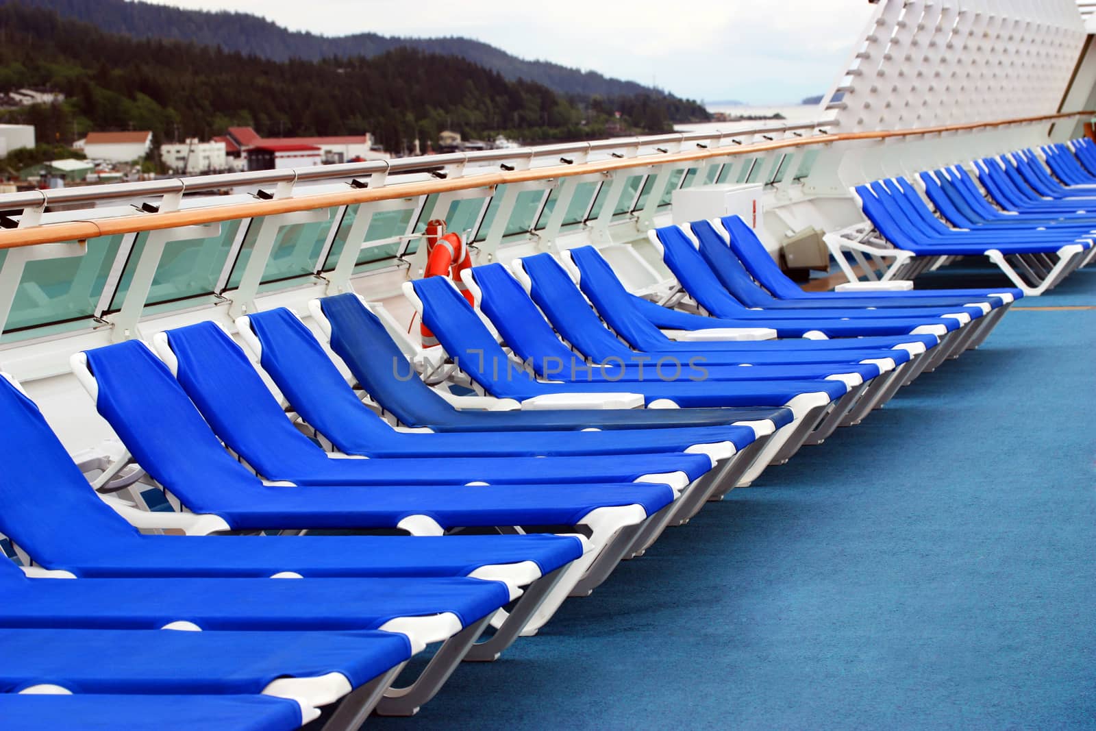Row of beach chairs on cruise ship deck