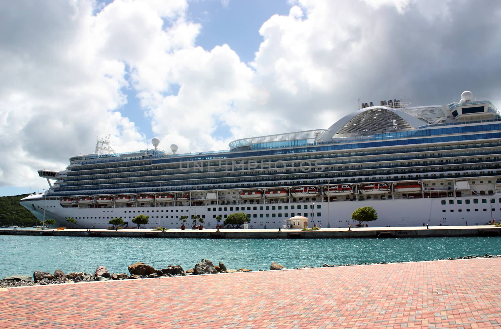 Big cruise ship near tropical island