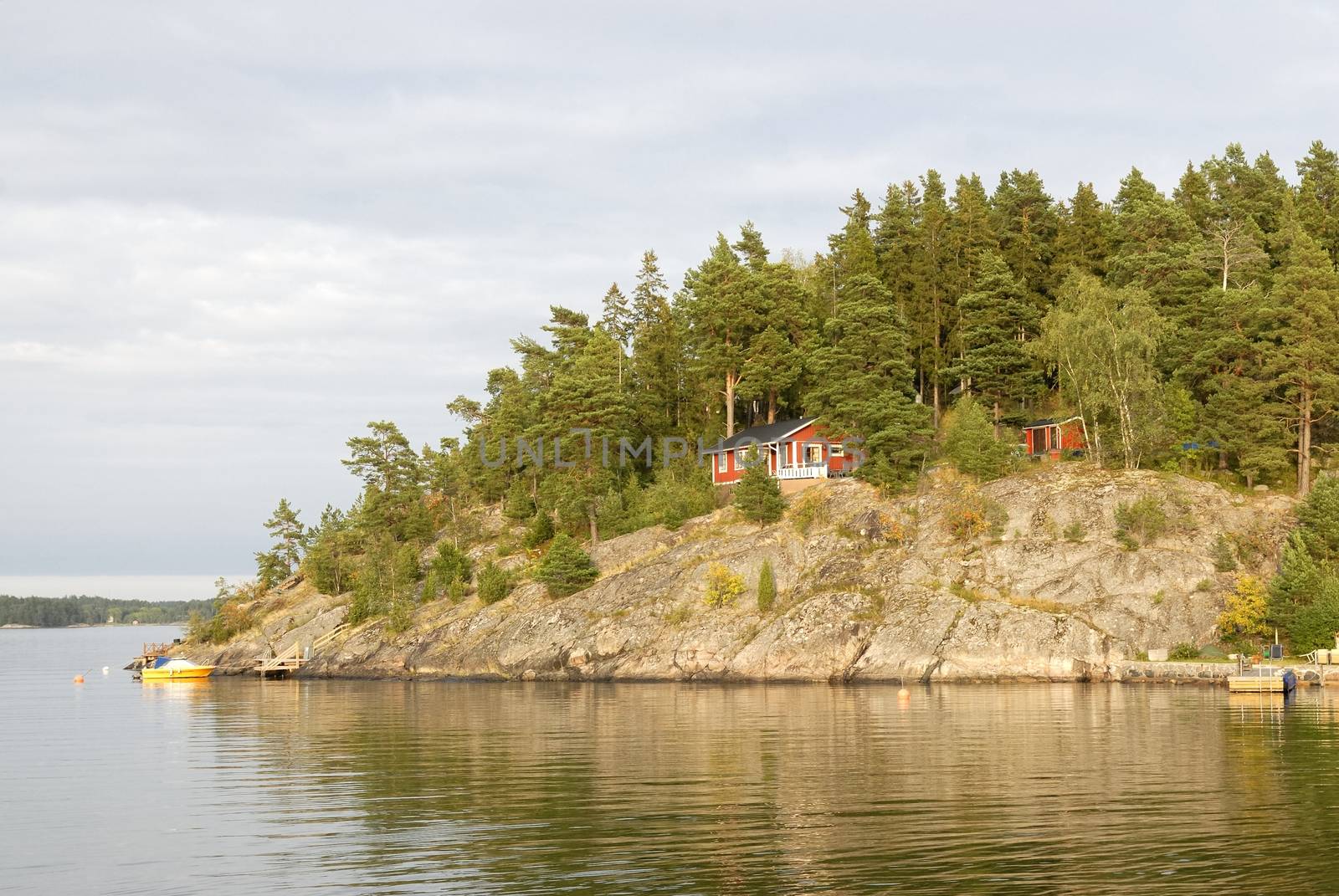 Idyllic houses by the baltic sea with jetties in a spring setting