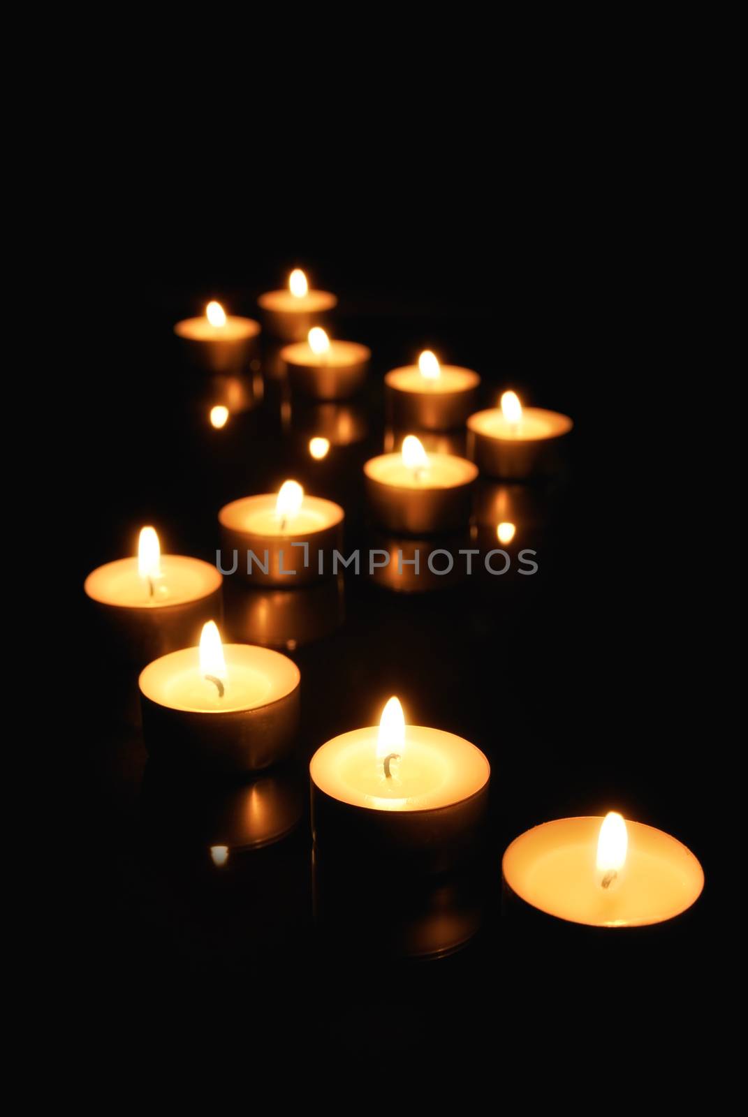 Small candles over black