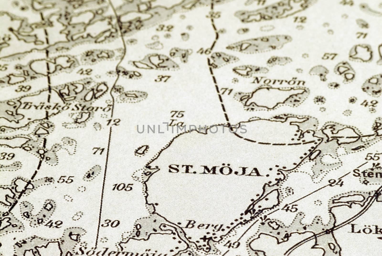 Macro shot of a marine very old chart, detailing Stockholm archipelago with the island "St.Möja" in focus.
