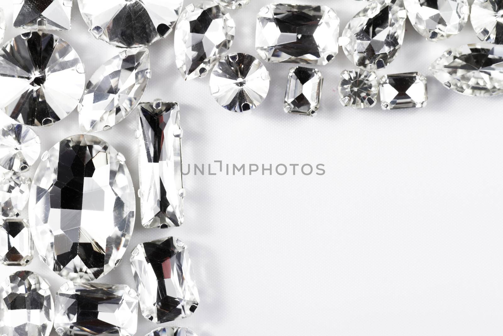 Large crystal strasses on a white background - macro photo