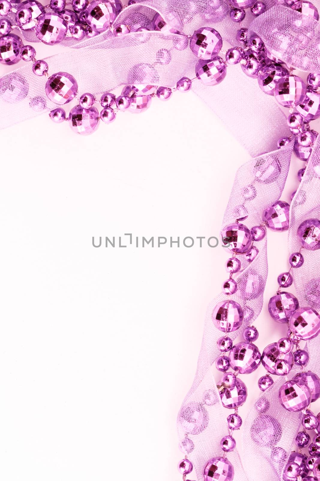 Close up of pink garland.  Light background.