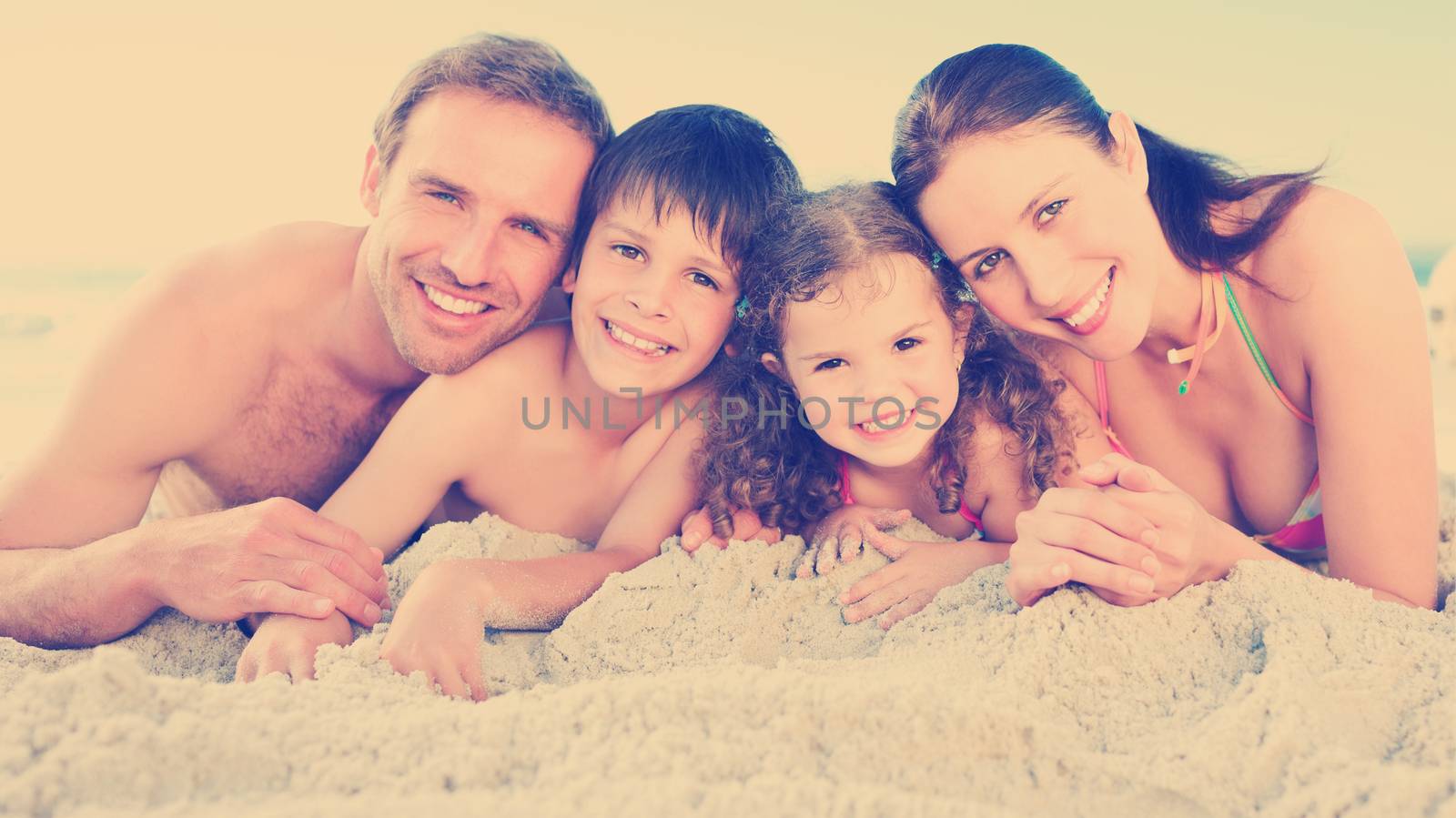 Family at the beach by Wavebreakmedia