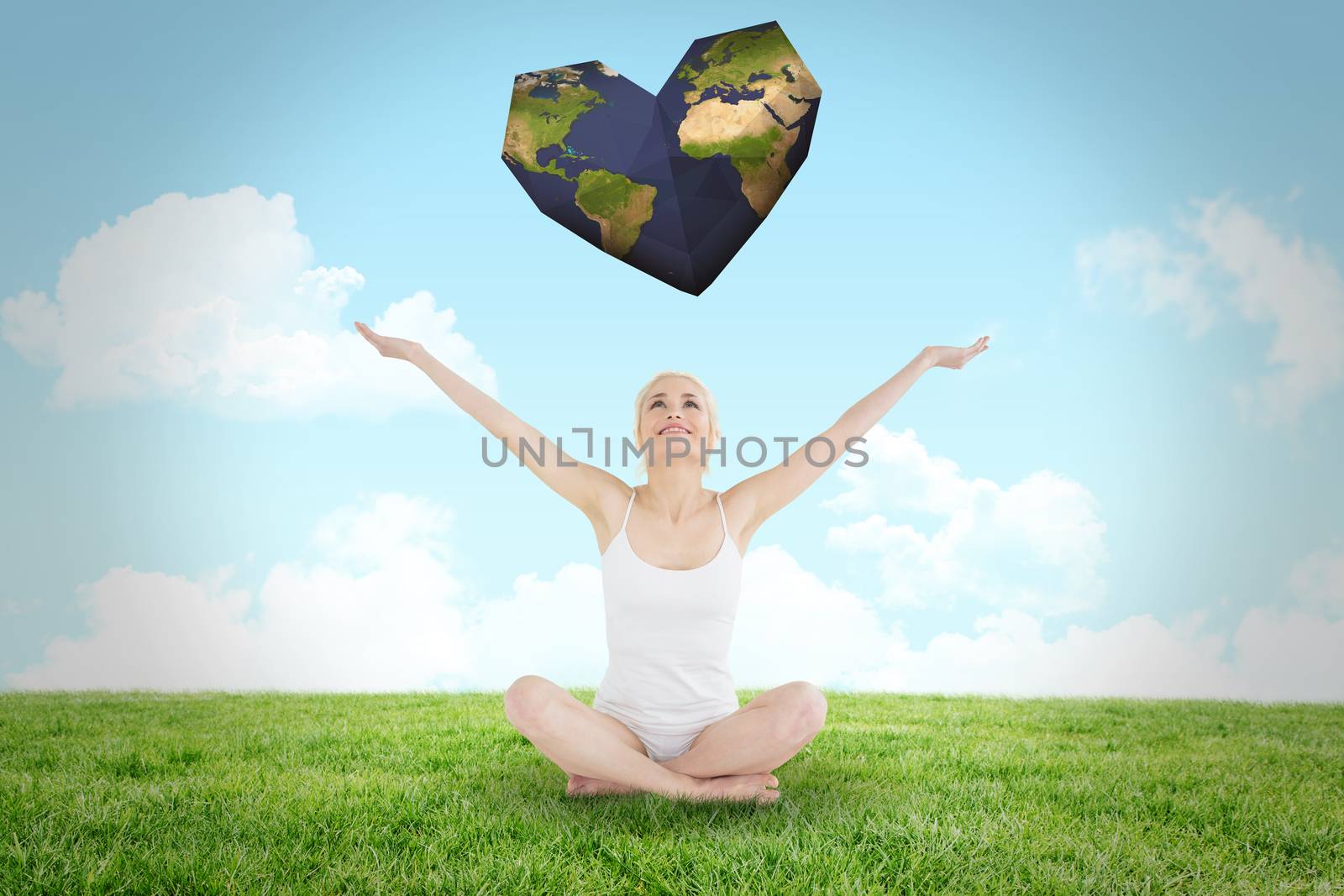 Toned young woman sitting with arms outstretched against field and sky