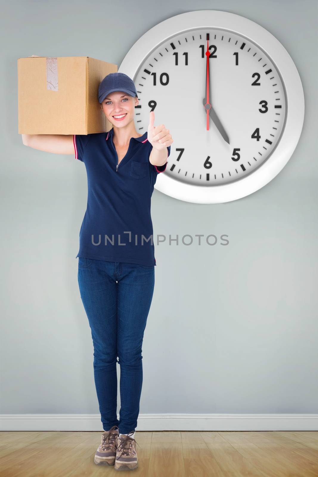 Composite image of happy delivery woman holding cardboard box by Wavebreakmedia