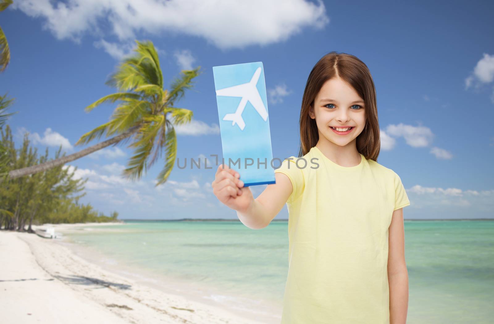 smiling little girl with airplane ticket by dolgachov