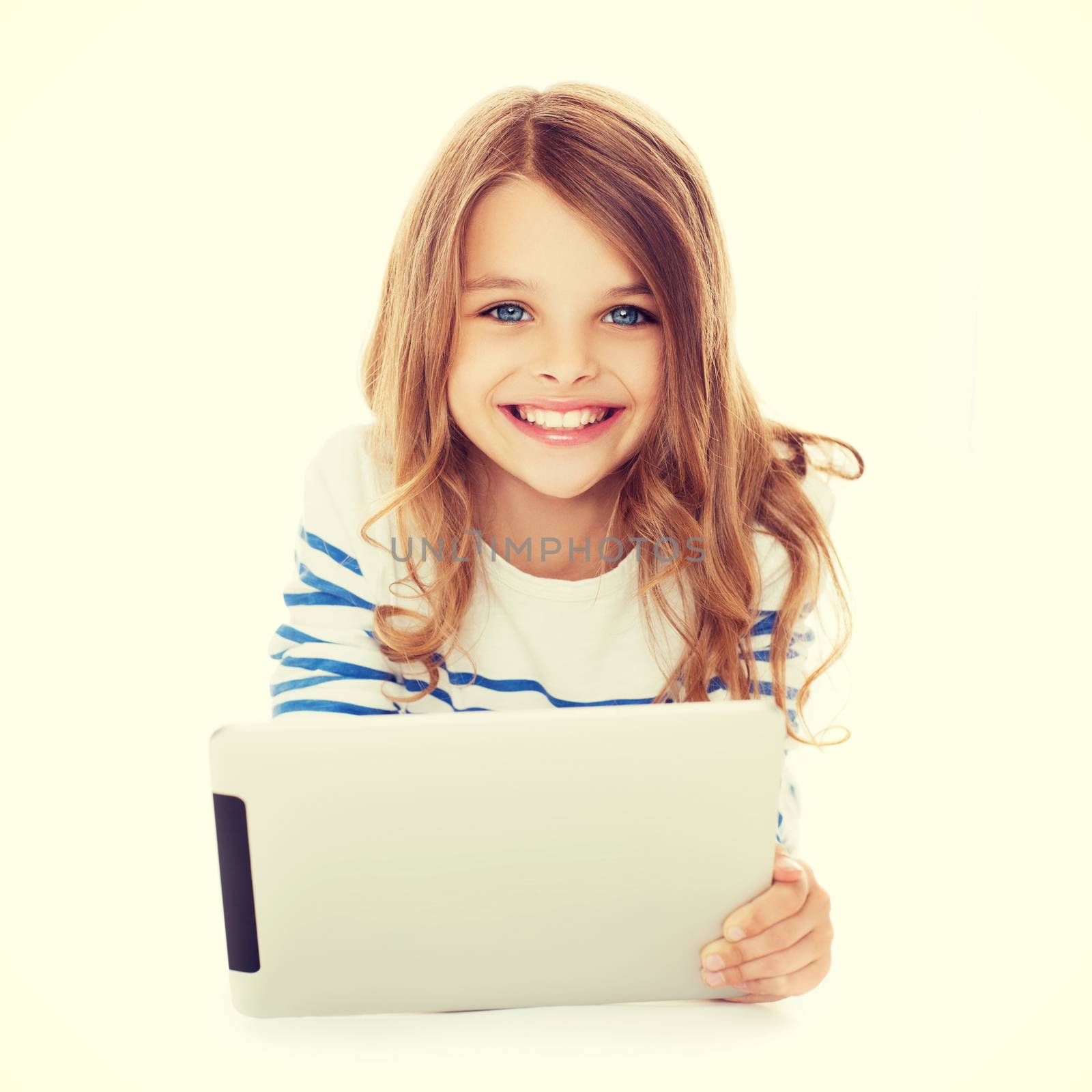 education, technology and internet concept - smiling little student girl with tablet pc computer