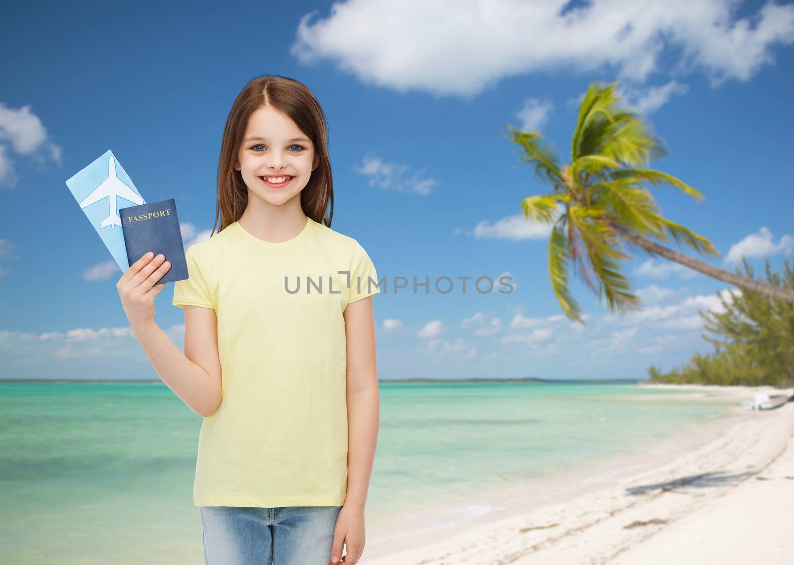 travel, holiday, vacation, childhood and transportation concept - smiling little girl with airplane ticket and passport