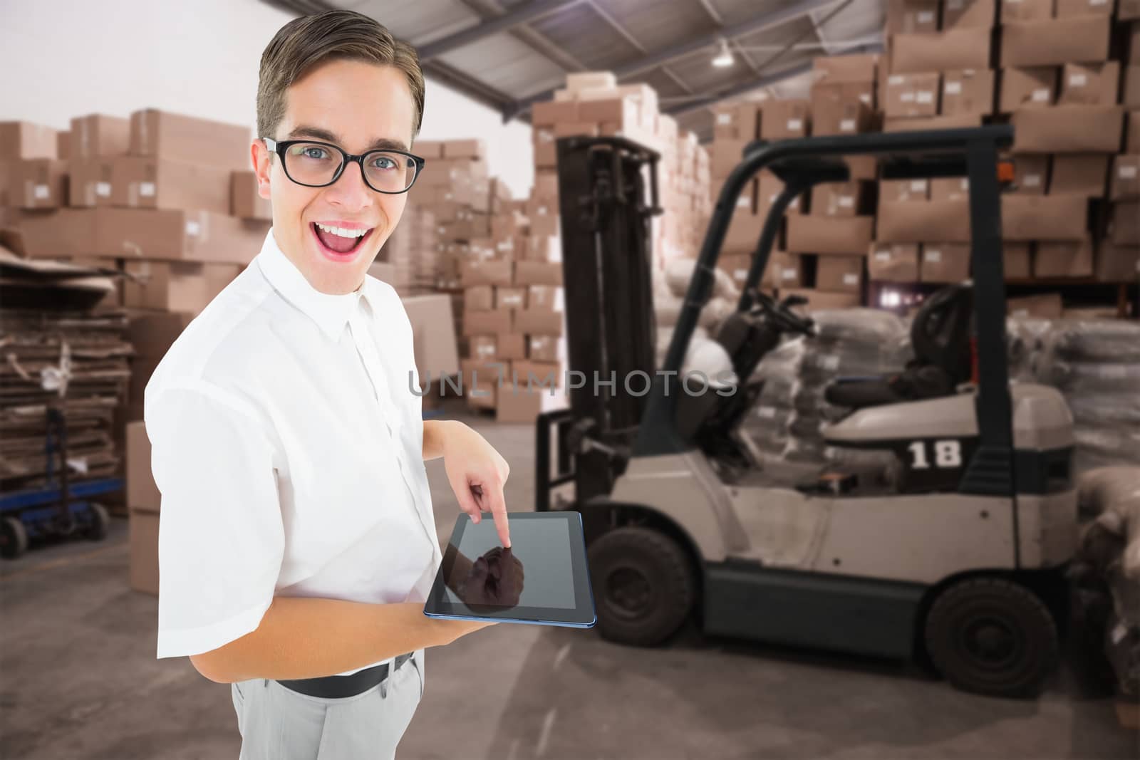 Geeky businessman using his tablet pc against warehouse worker loading up pallet