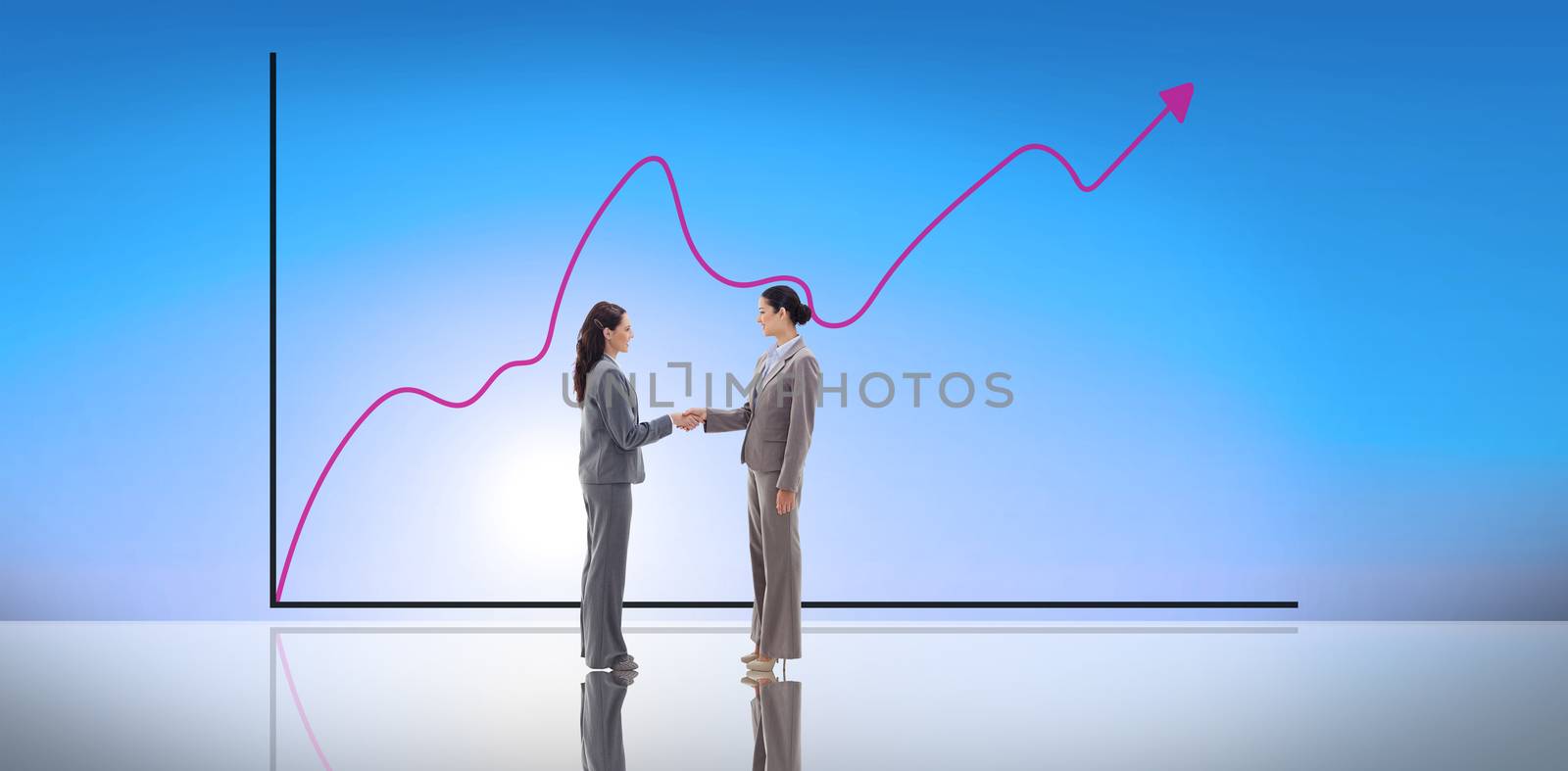 Businesswomen shaking hands against blue sky