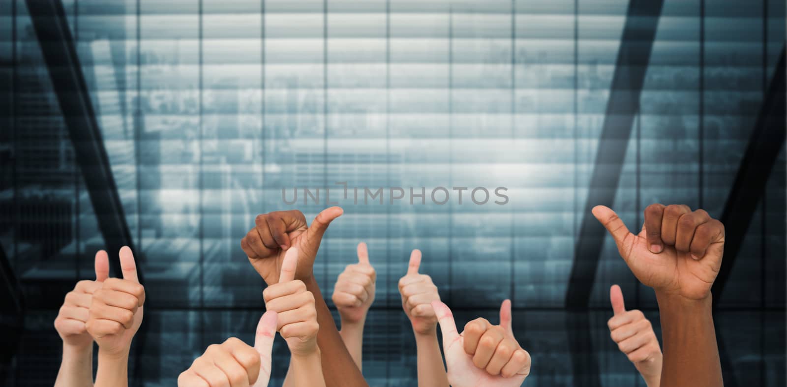 Hands giving thumbs up  against room with large window looking on city