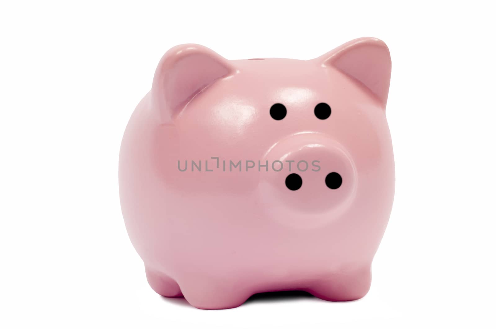 Close up shot of a small pink piggy bank isolated on white background.  Looking forward.