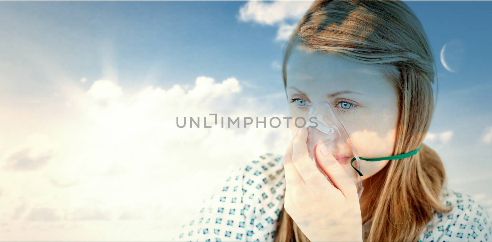 blue sky against female young patient with a mask 