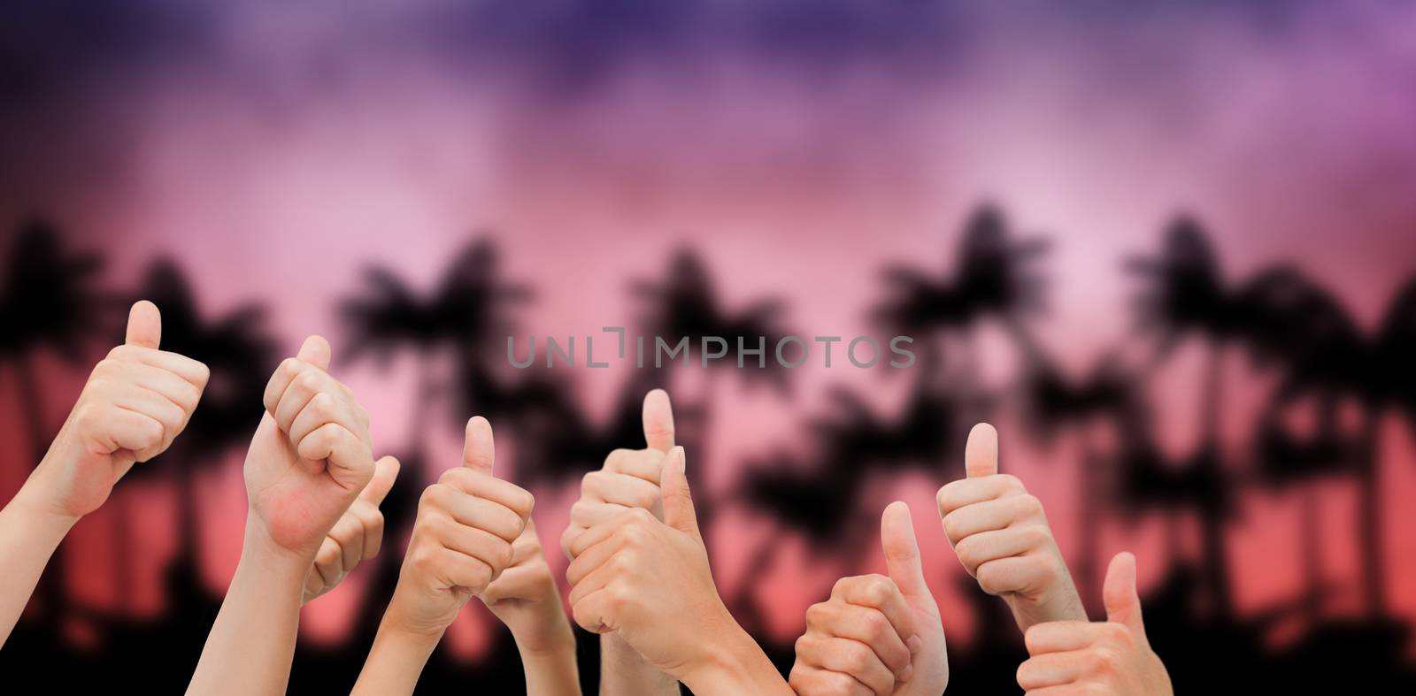 Group of hands giving thumbs up against digitally generated palm tree background