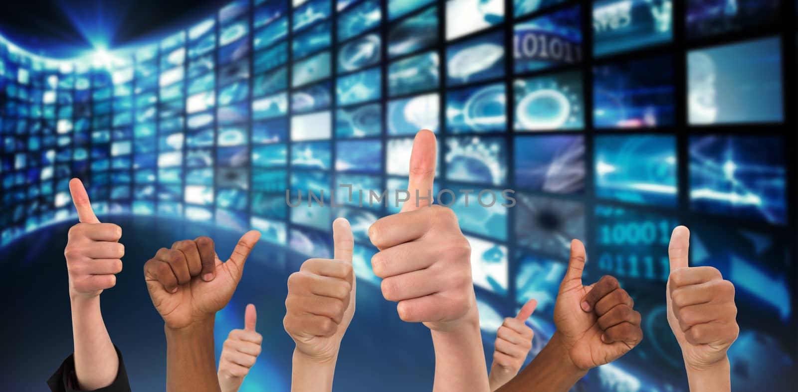 Hands showing thumbs up against curve of digital screens in blue