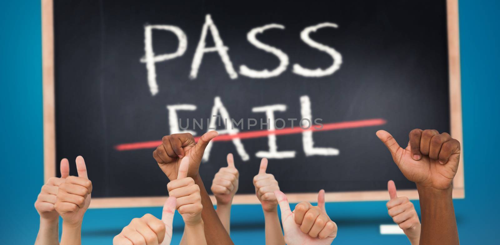 Hands giving thumbs up  against pass and fail written on blackboard