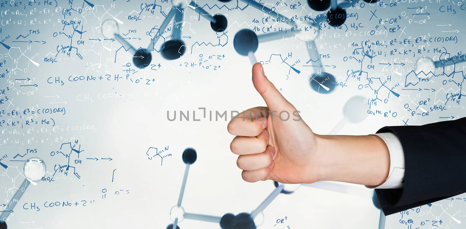 Hand showing thumbs up against notes of biotechnology and genes