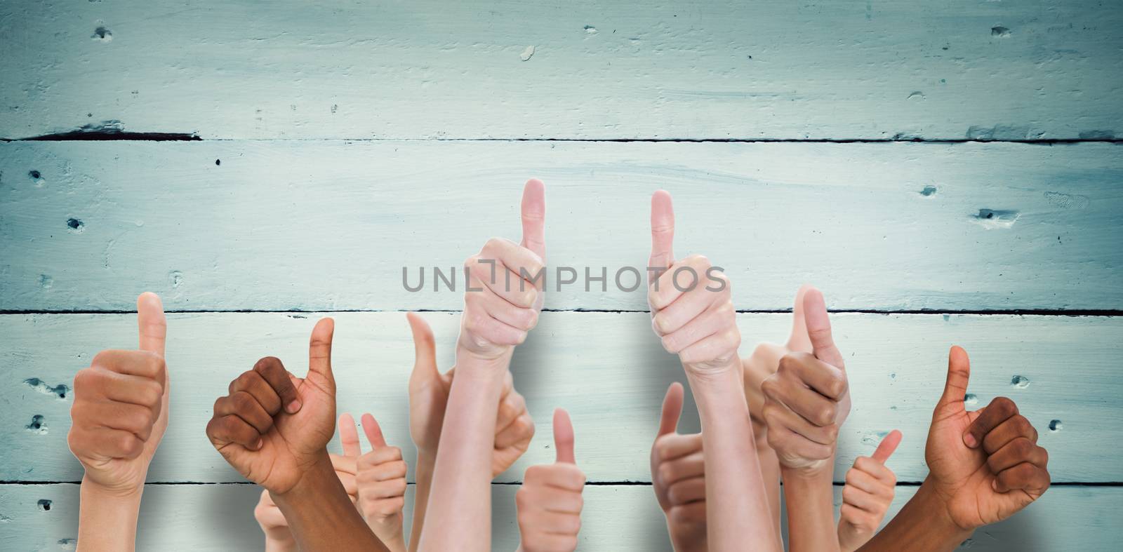 Hands showing thumbs up against painted blue wooden planks