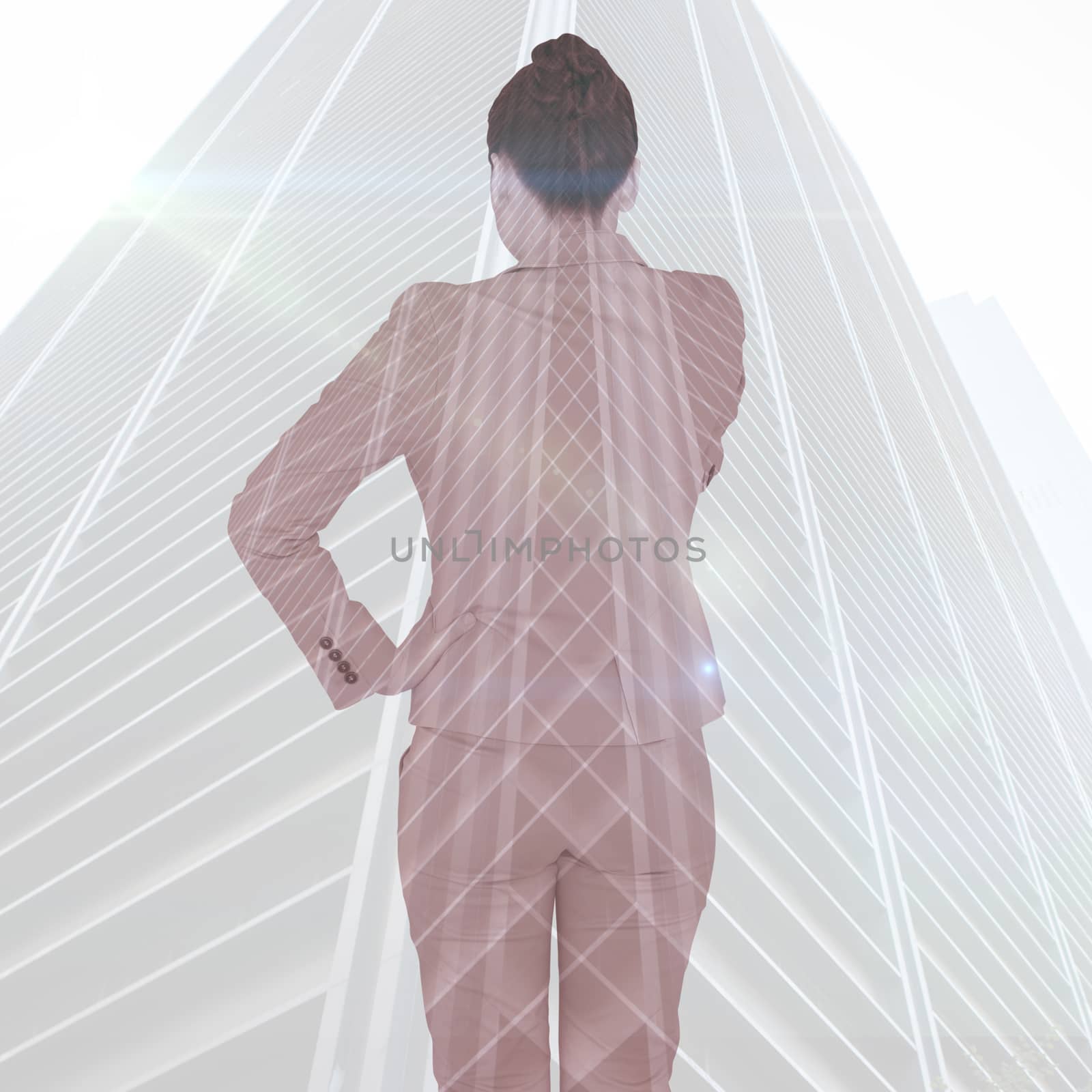 Asian businesswoman pointing against low angle view of skyscraper