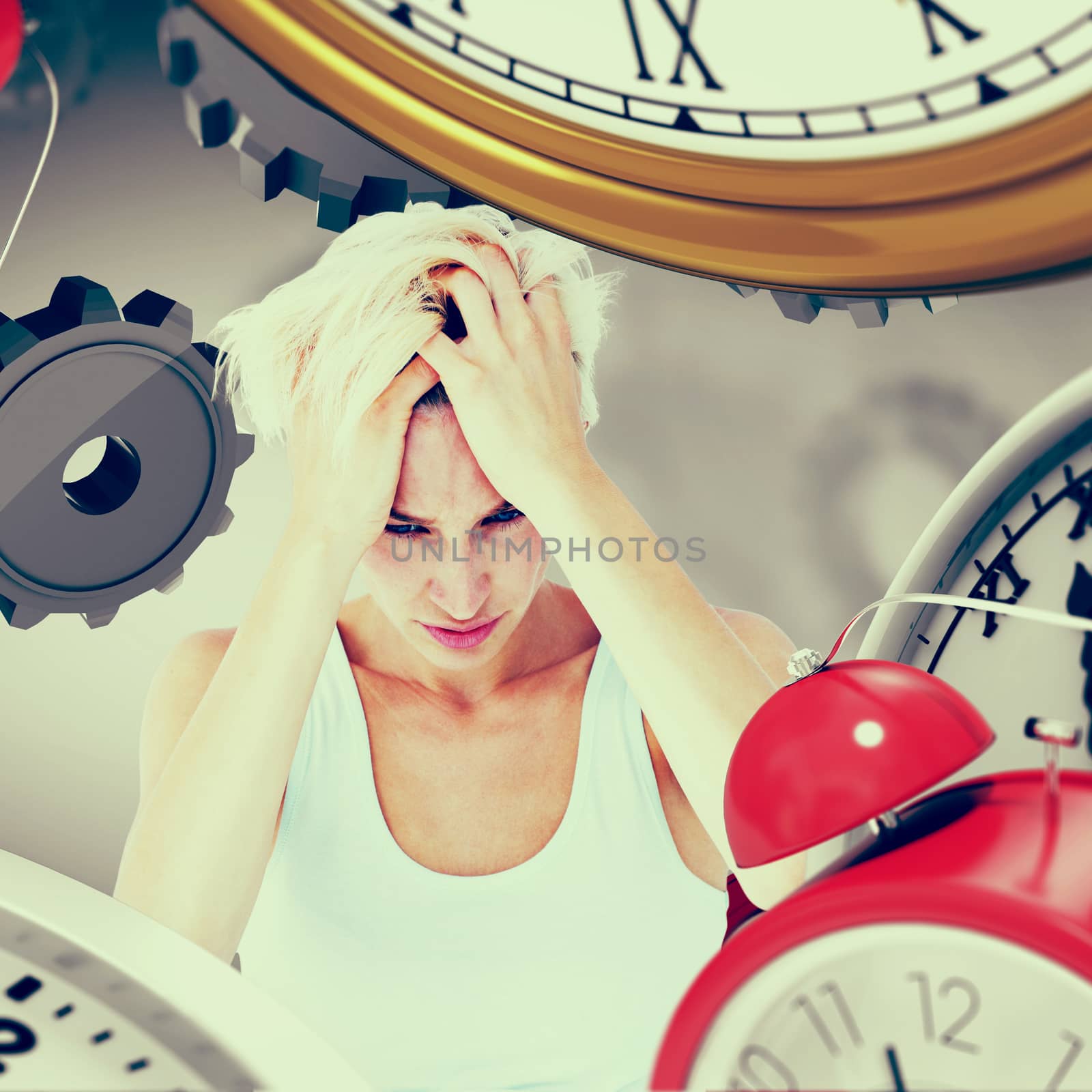 Sad blonde woman with head pain holding her head  against grey vignette