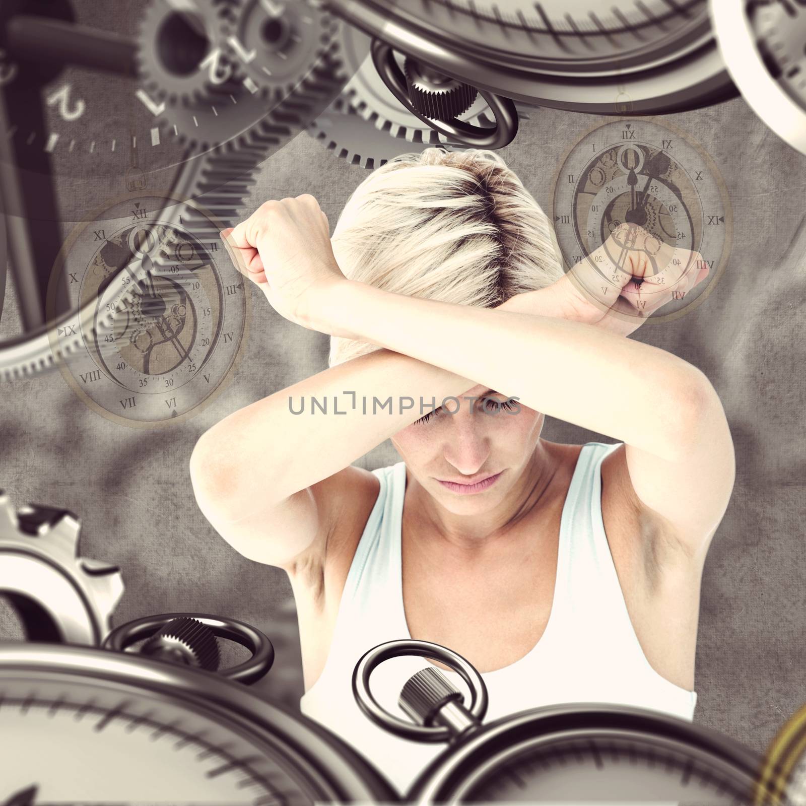 Upset woman holding her arms in front of her head against grey background