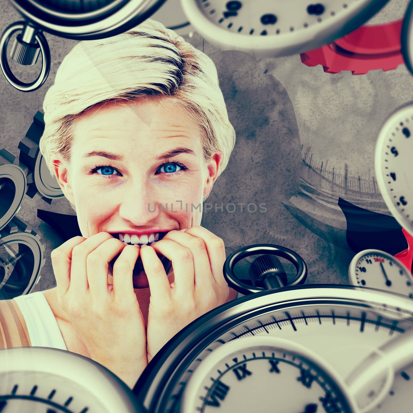 Nervous woman biting her nails looking at camera  against grey background