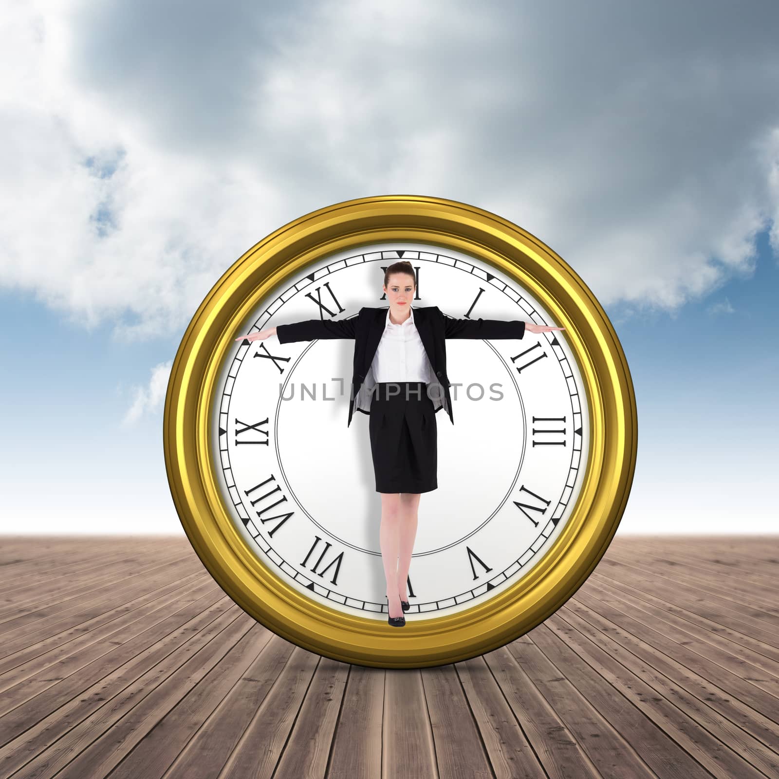 Businesswoman performing a balancing act against cloudy sky background