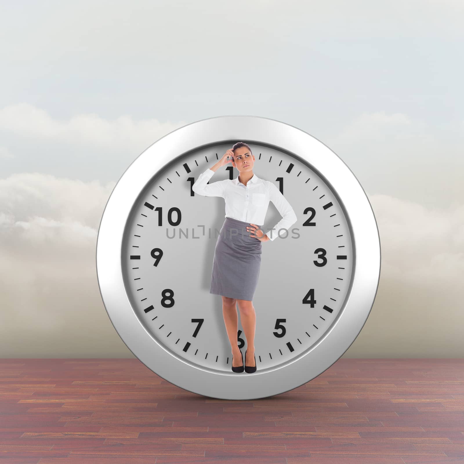 Focused businesswoman against clouds in a room