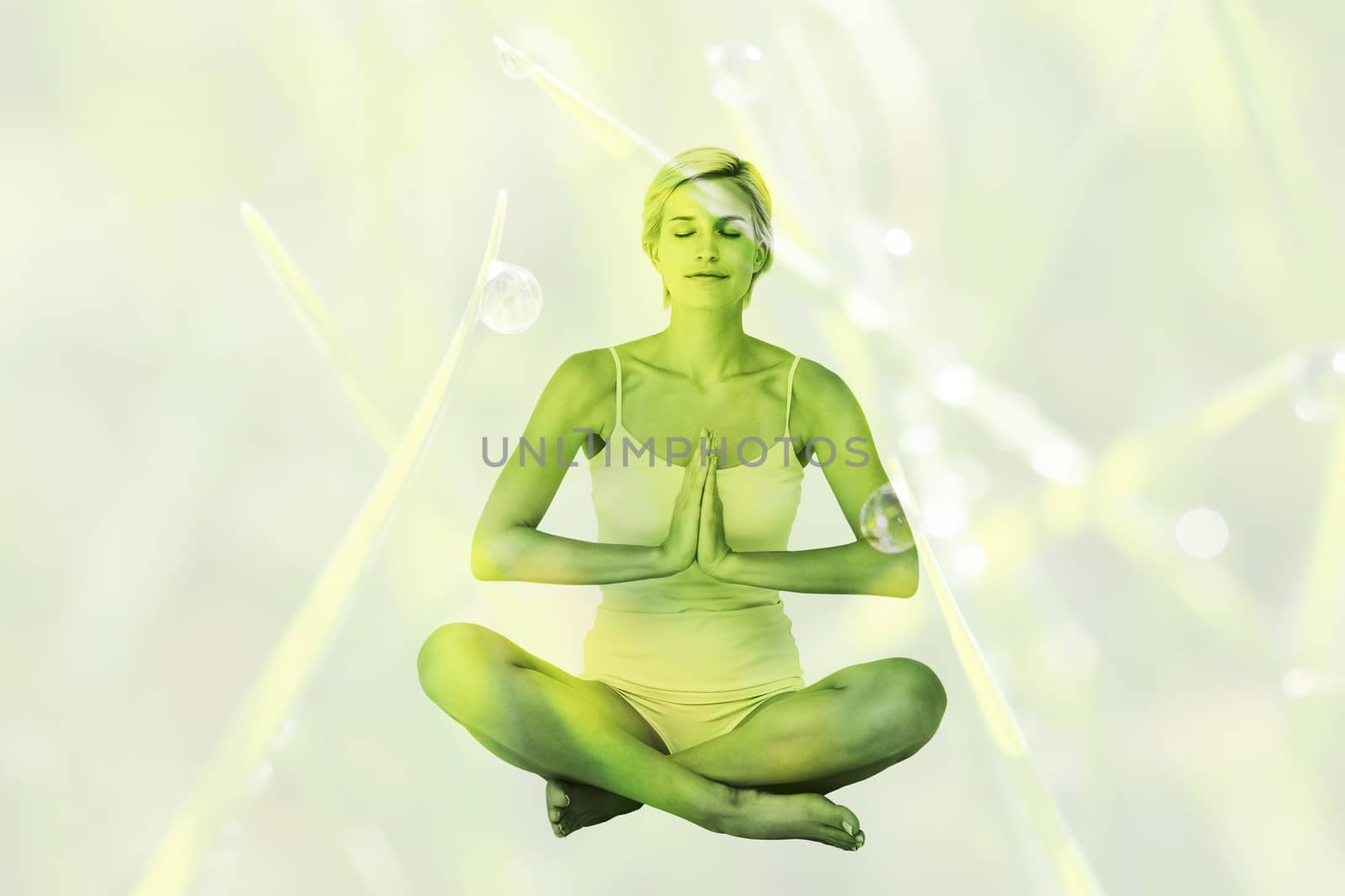 Composite image of fit woman doing yoga by Wavebreakmedia