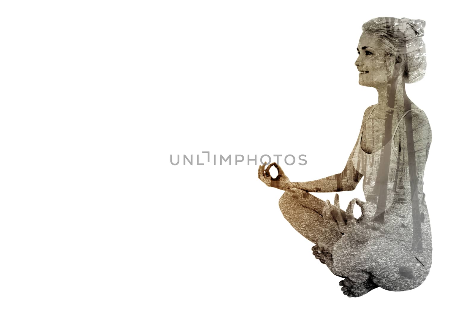 Composite image of full length of toned woman sitting in lotus position by Wavebreakmedia