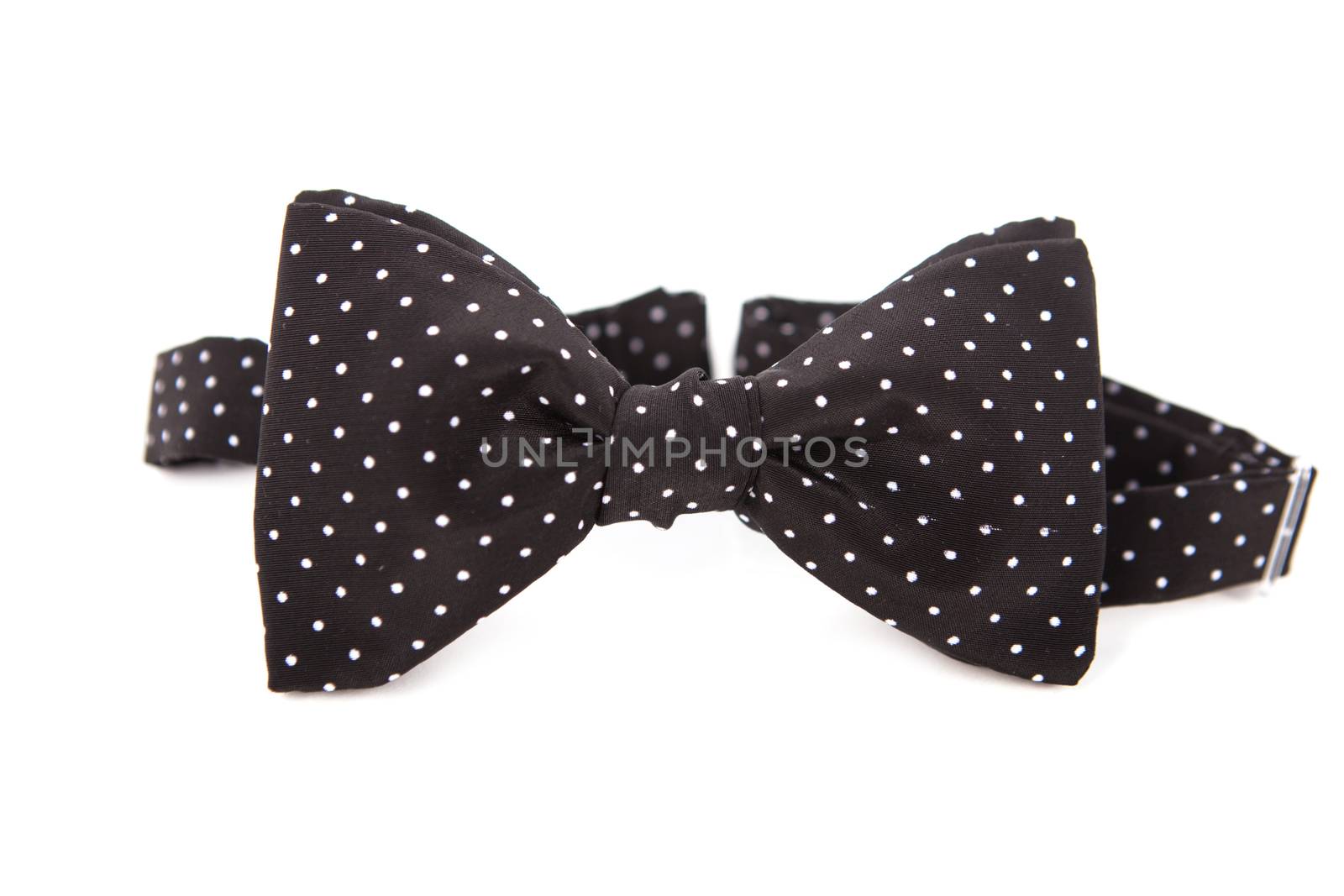 Accessory for a gentleman bow tie. Made of linen fabric. Black with white polka dots.