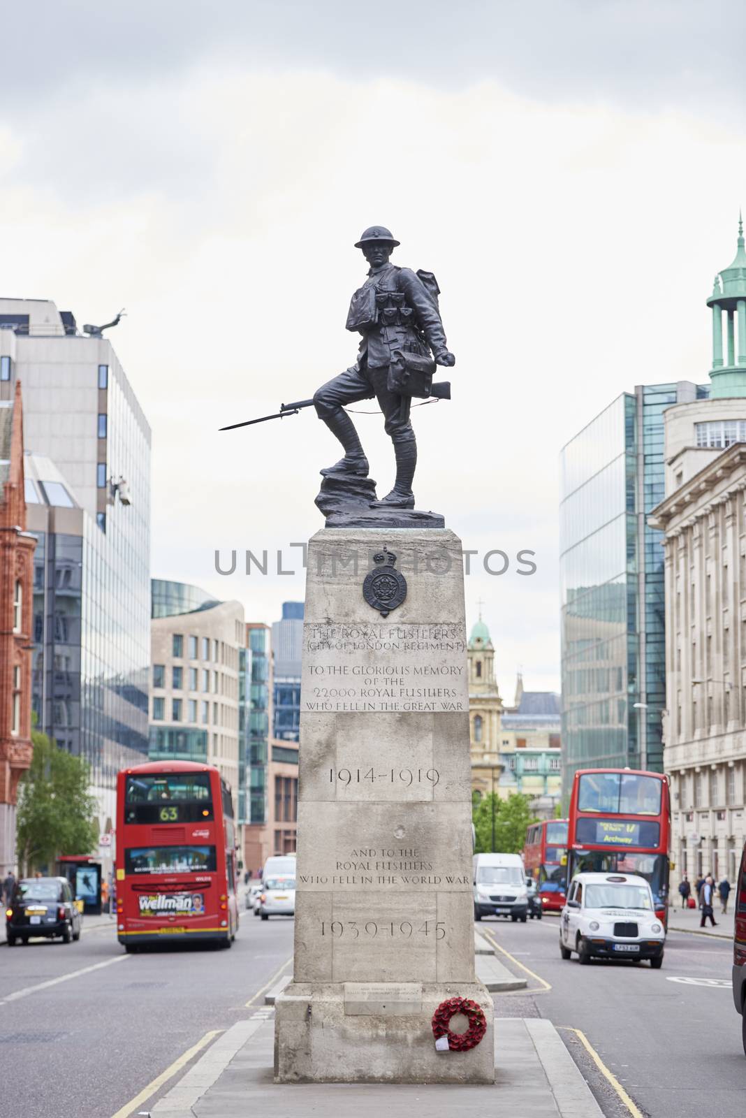 LONDON, UK - JUNE 23: Royal Fusiliers war memorial, by Albert Toft, in between traffic lanes in Chancery Lane. June 23, 2015 in London.