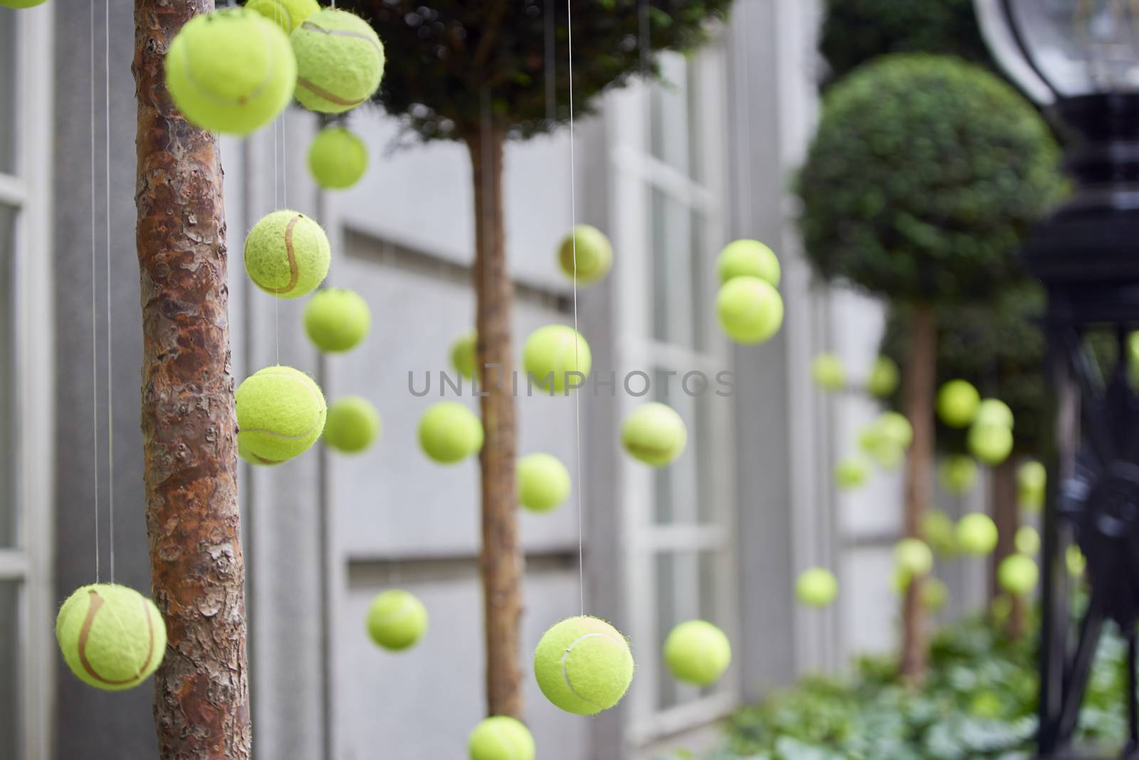 LONDON, UK - JUNE 23: Tennis balls decoration in front of Rosewood Hotel. June 23, 2015 in London. Two main tennis competitions in the UK take place in June: The Aegon Championships and Wimbledon.