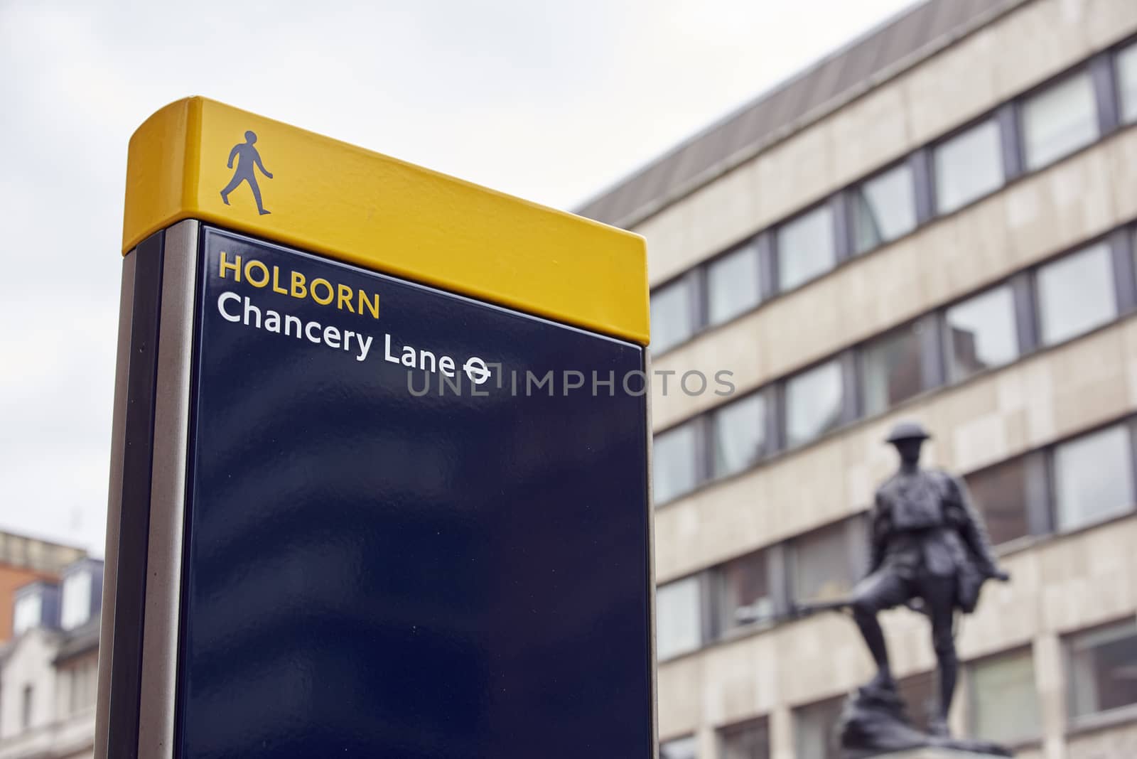 LONDON, UK - JUNE 23: Chancery Lane Station sign with war memorial in the background. June 23, 2015 in London.