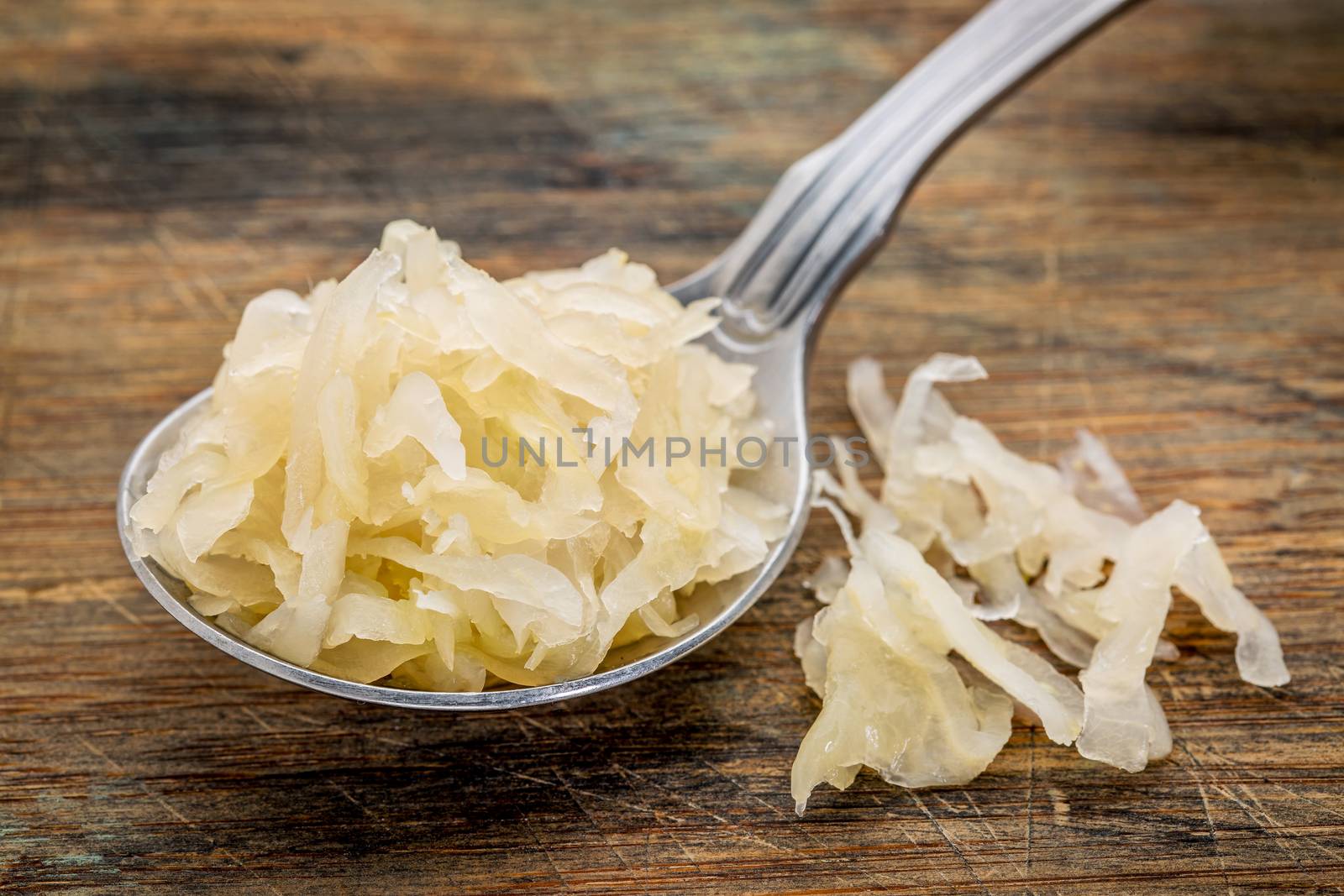 tablespoon of sauerkraut by PixelsAway