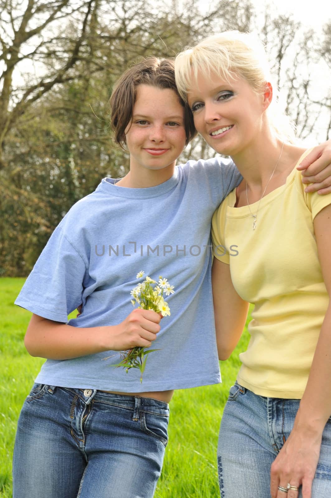 Daughter offering flowers to her mother