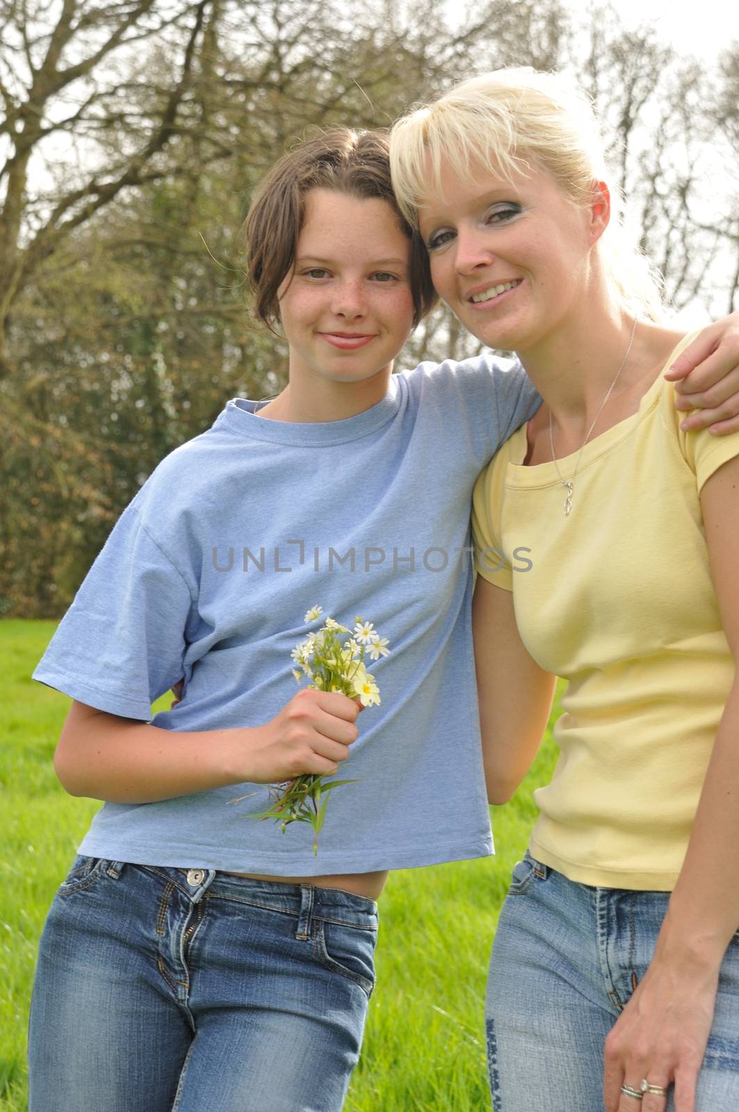 Daughter offering flowers to her mother