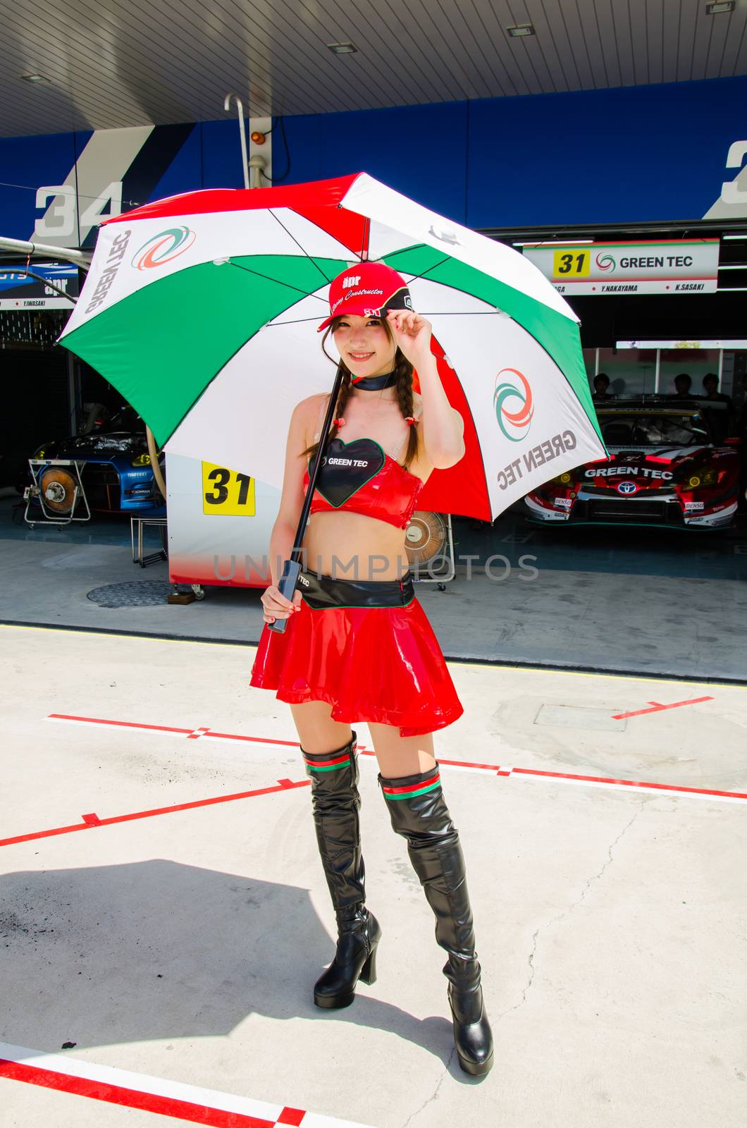 BURIRAM - JUNE 20: Unidentified Race Queen of Japan with racing car on display at The 2015 Autobacs Super GT Series Race 3 on June 20, 2015 at Chang International Racing Circuit, Buriram Thailand