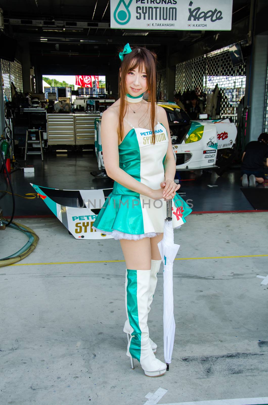 BURIRAM - JUNE 21: Unidentified Race Queen of Japan with racing car on display at The 2015 Autobacs Super GT Series Race 3 on June 21, 2015 at Chang International Racing Circuit, Buriram Thailand