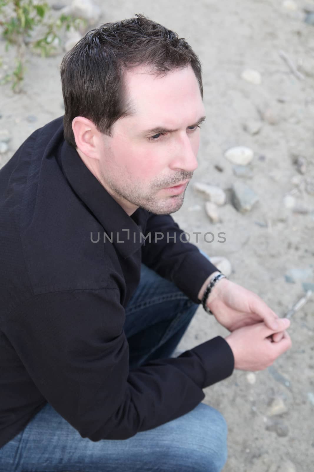 Attractive male model outdoors at the beach