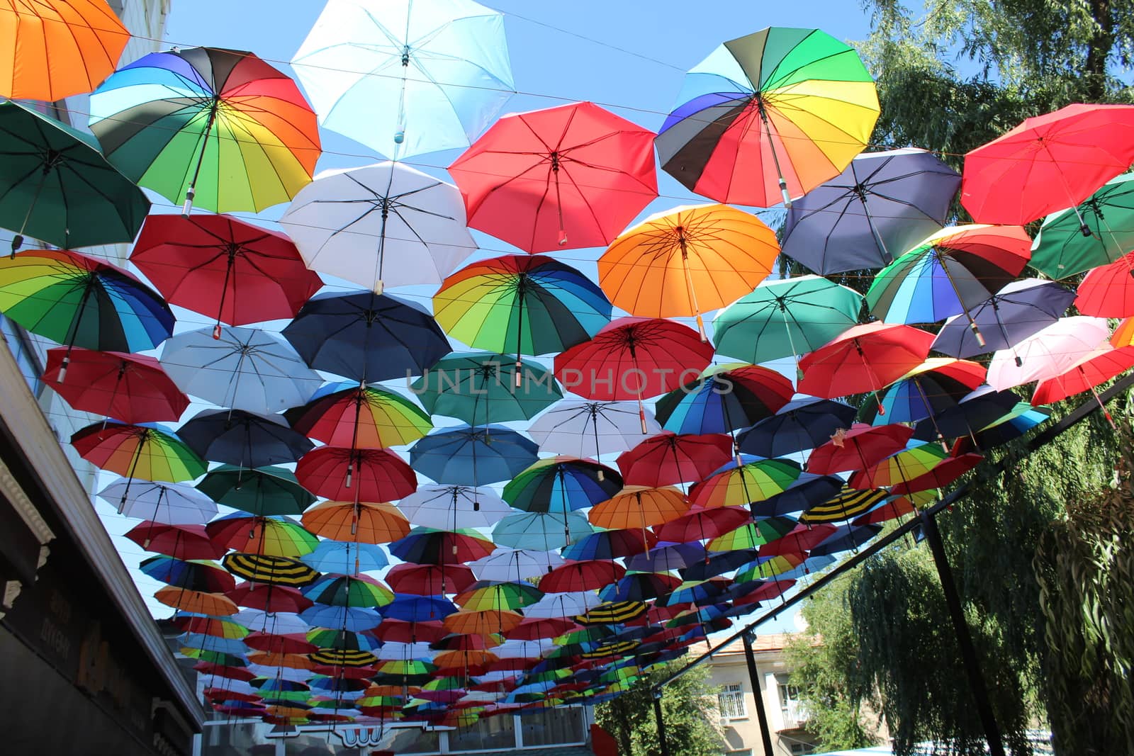 Soaring in the sky multi-colored umbrellas.